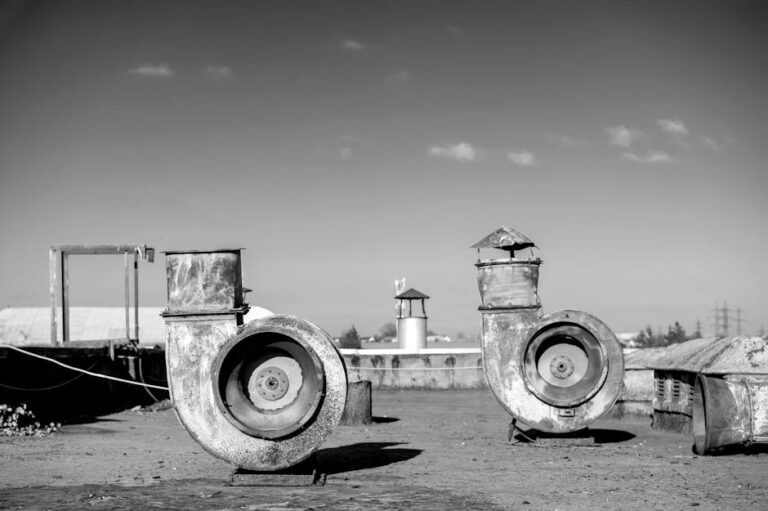 Black and white photo of old rooftop ventilators in Lviv, Ukraine, showing industrial architecture.