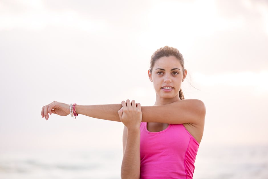 Young woman enjoying a relaxing stretch on a sunny Australian beach. Perfect for lifestyle and fitness themes.