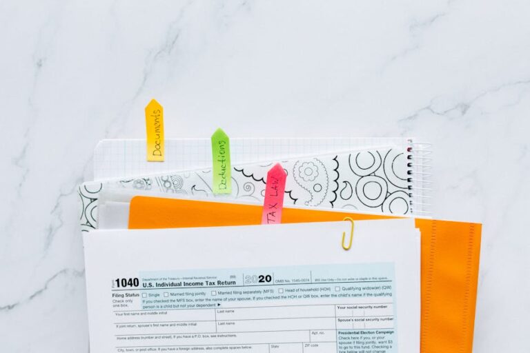 Colorful tabs organizing tax documents for easy filing and reference.