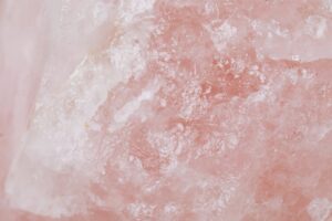 Detailed view of rose quartz showcasing its pink crystalline texture and natural patterns.