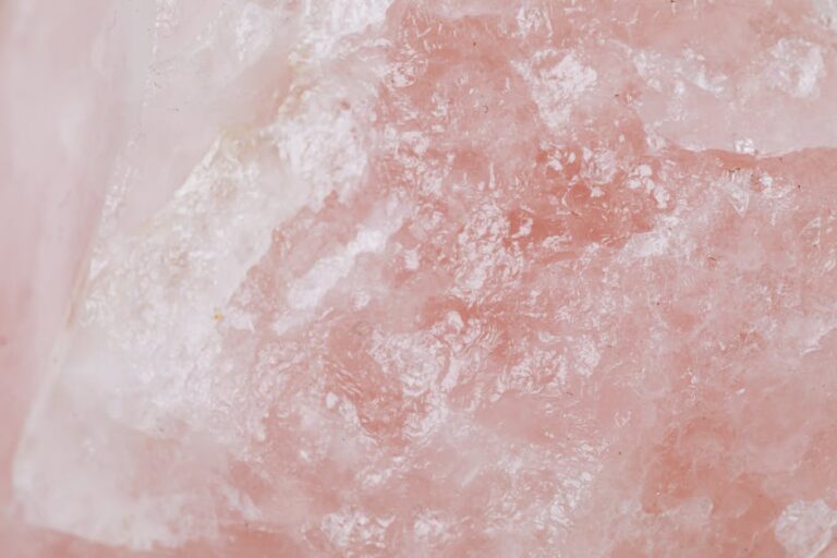 Detailed view of rose quartz showcasing its pink crystalline texture and natural patterns.
